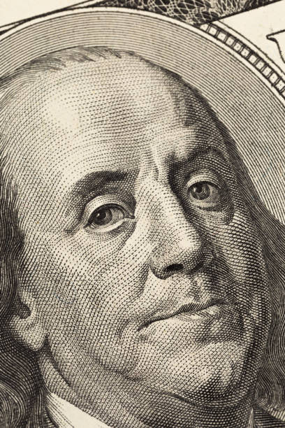 istock Benjamin Franklin's look on a hundred dollar bill. Benjamin Franklin portrait macro usa dollar banknote or bill 1136796680