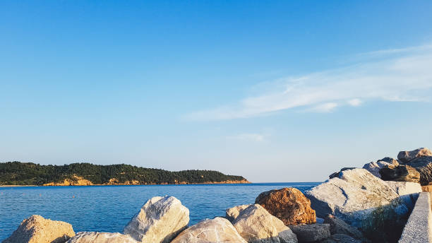 istock Big rocks on sea shore 1136796719