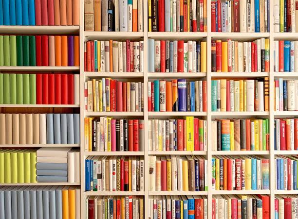 istock Colorful generic and real books in white shelves 1136796919