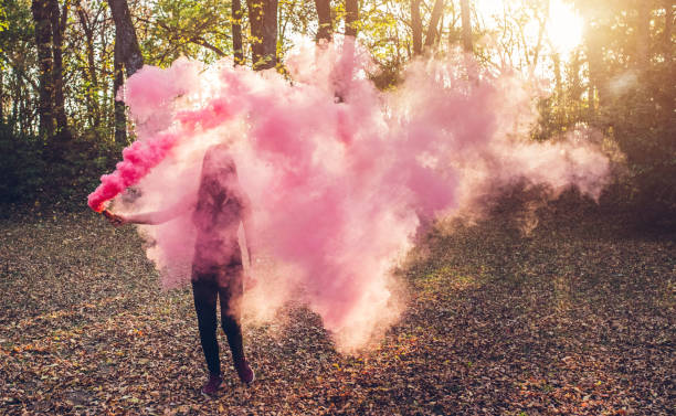 istock Girl holding smoke fountain 1136797470
