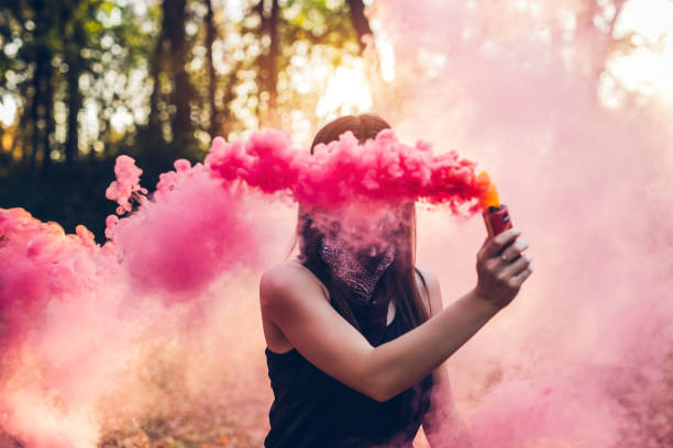 istock Girl holding smoke fountain 1136797574