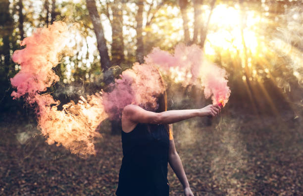 istock Girl holding smoke fountain 1136797599