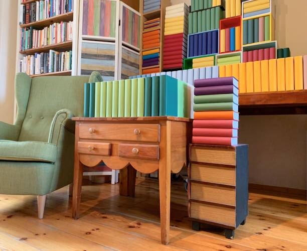 istock Colorful generic books and a green chair 1136797604