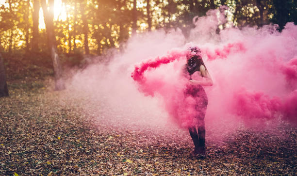 istock Girl holding smoke fountain 1136797620