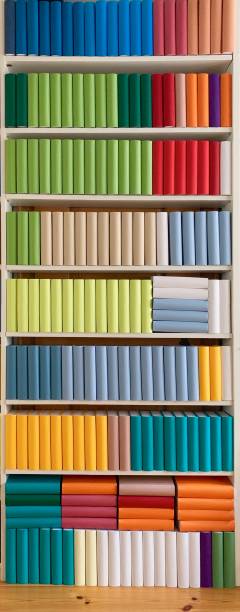 colorful generic books in white shelves - library book shelf generic imagens e fotografias de stock