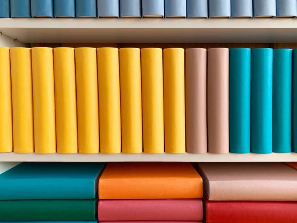 istock Colorful generic books in white shelves 1136797807