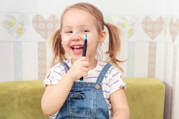 Photo of child painted his nose