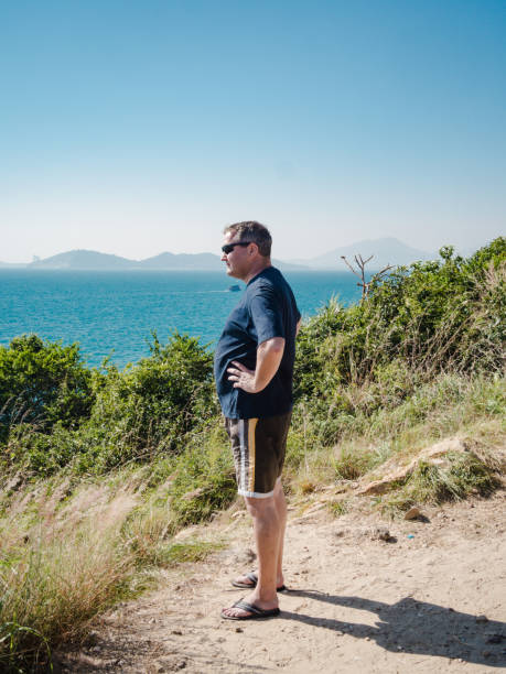 istock Caucasian man is looking over the coast in thailand 1136799235