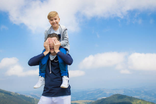 istock Happy boy having fun with his father against the sky. 1136803150
