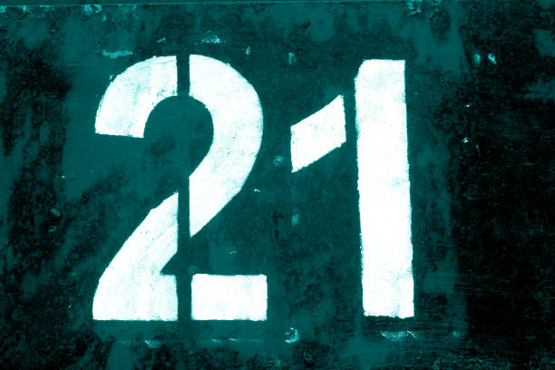 istock Number 21 in stencil on metal wall in cyan tone. 1136803686