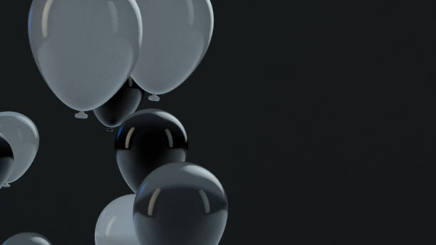 istock Black and White balloon floating in the air 1136803944