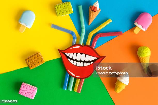 Flat Lay Of Funny Smile With Drinking Straws Ice Cream And Biscuits On Multicolored Background Abstract Stock Photo - Download Image Now