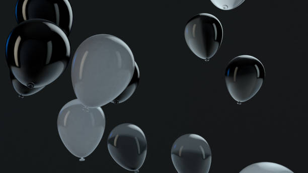 istock Black and White balloon floating in the air 1136804598