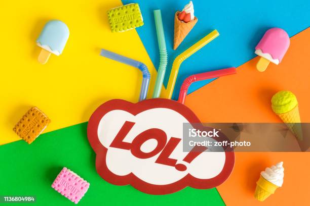 Lol Text In Speech Bubble With Drinking Straws Ice Cream And Biscuits Against Multicolored Background Abstract Stock Photo - Download Image Now