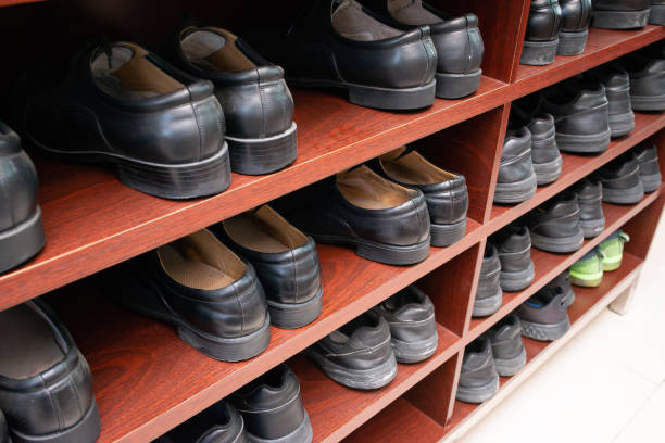 istock unified black leather shoes on shelf 1136806071