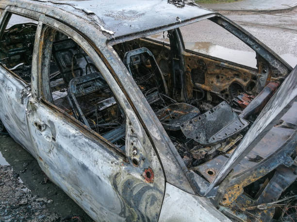 istock Burnt car on the road 1136806410