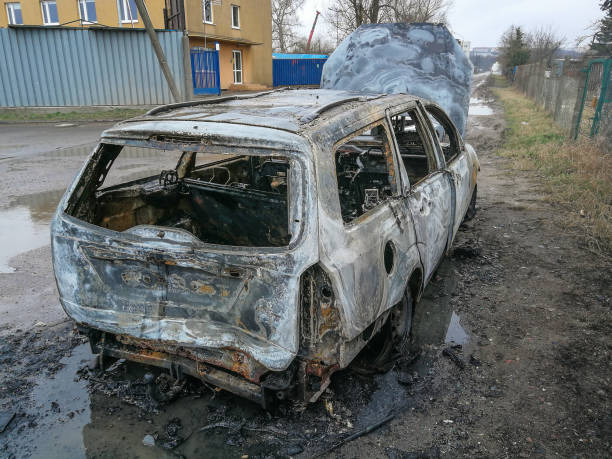 istock Burnt car on the road 1136806415