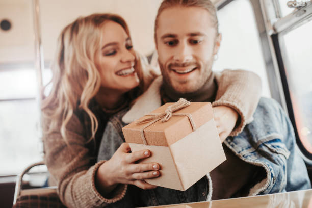 istock Happy lady making surprise present to her lover 1136807204
