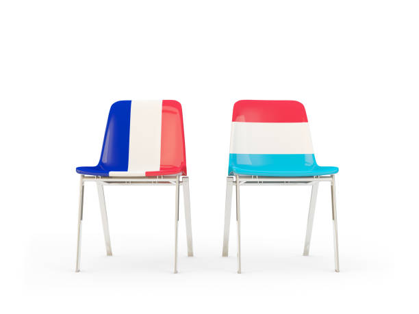 Two chairs with flags of France and luxembourg stock photo