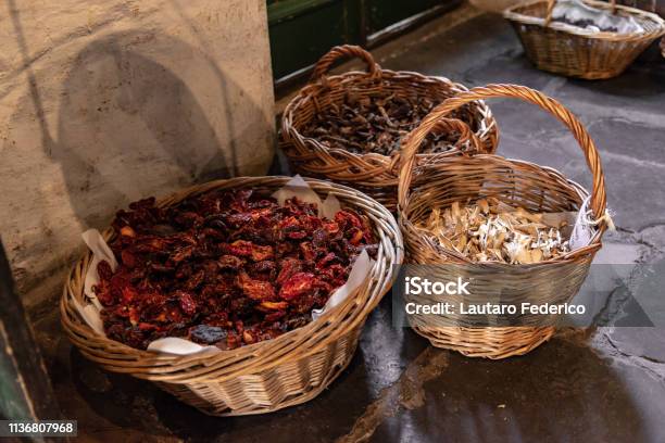 Baskets With Dried Aliments Inside Like Dried Tomatoes Mushrooms Raisins And Roots Stock Photo - Download Image Now