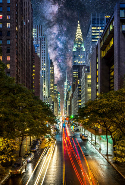 night at East 42nd street in NYC, Manhattan, New York light trails in E42nd street of Manhattan at night with milkyway in the sky. New York 42nd street photos stock pictures, royalty-free photos & images