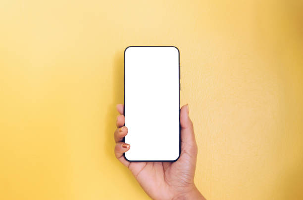 istock Human hand holding smartphone with white screen background. 1136809542