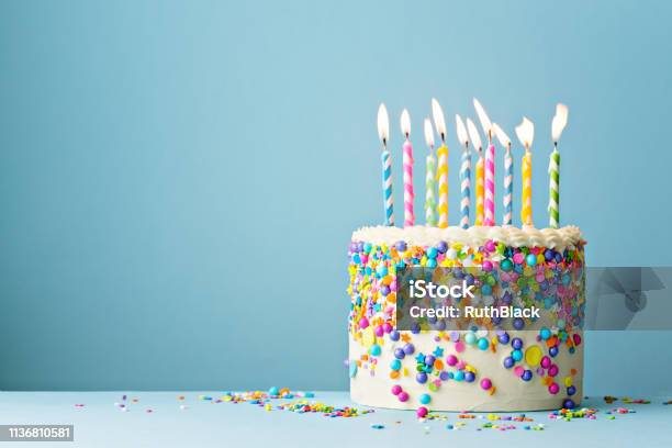 Birthday Cake Decorated With Colorful Sprinkles And Ten Candles Stock Photo - Download Image Now