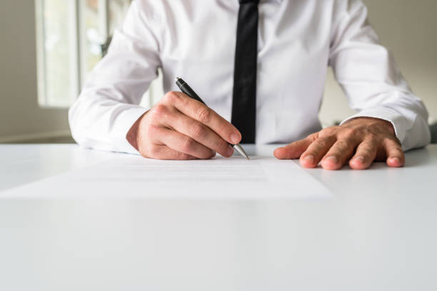istock Front view of businessman signing a document 1136811538