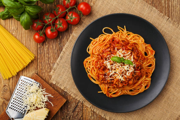 istock Delicious spaghetti served on a black plate 1136812936