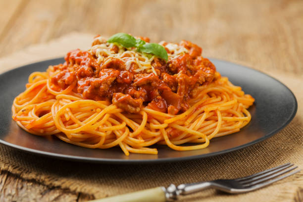 istock Delicious spaghetti served on a black plate 1136813727