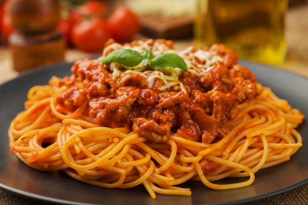 istock Delicious spaghetti served on a black plate 1136814412