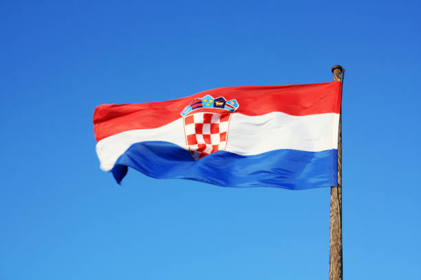 istock Croatia flag waving on the blue sky. 1136815478