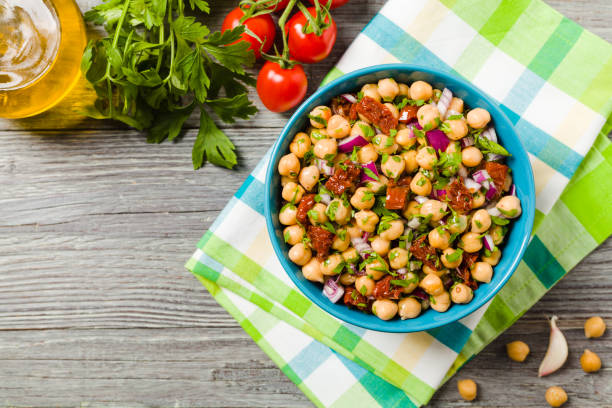 istock Chickpeas salad with onion and dried tomatoes. 1136816105