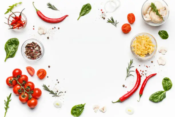 Photo of Colorful pizza ingredients on white background, top view