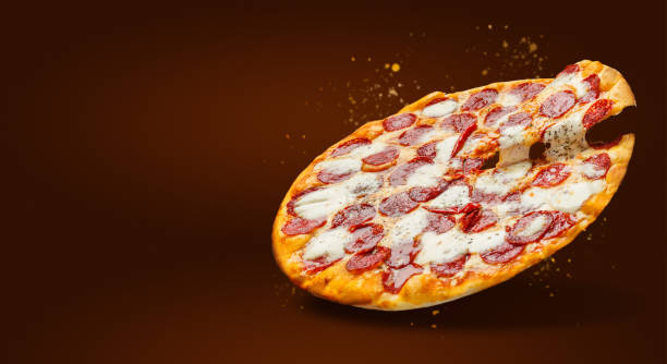 istock Flying delicious pizza with cheese and salami 1136817043