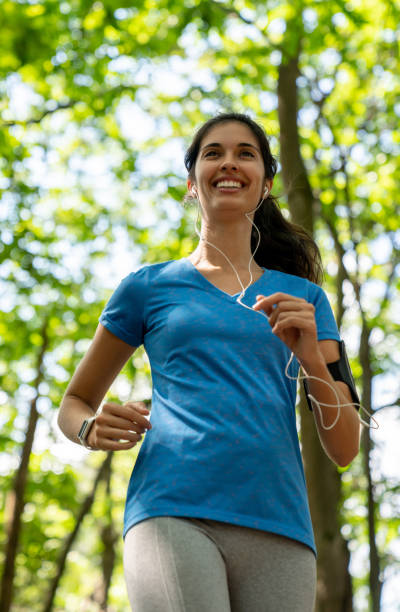 istock Happy female runner at the park 1136817428