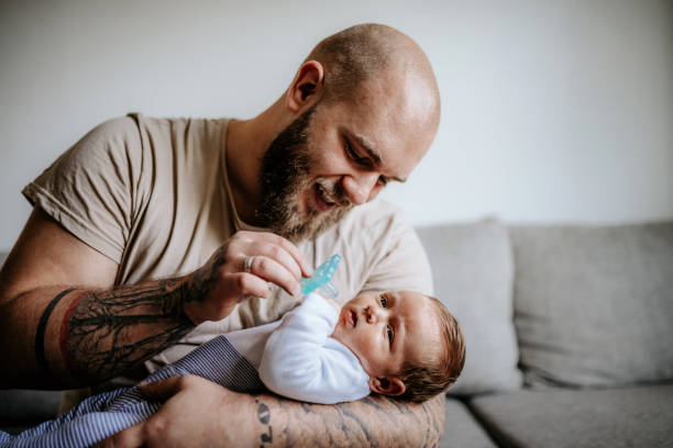 You are my world Father holding his newborn baby in arms alternative lifestyle stock pictures, royalty-free photos & images