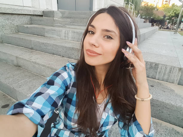 istock Urban girl making selfies downtown 1136819846