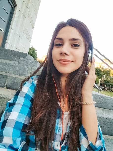 istock Urban girl making selfies downtown 1136819914