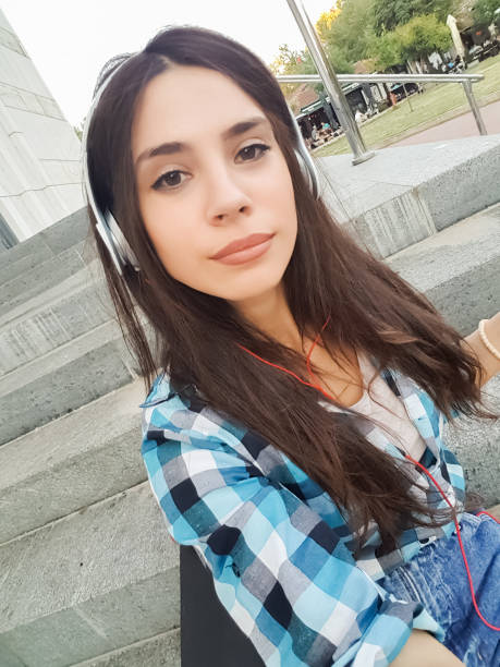 istock Urban girl making selfies downtown 1136819958