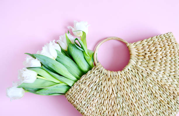 istock Wicker Handbag with Flowers Tulips 1136820648