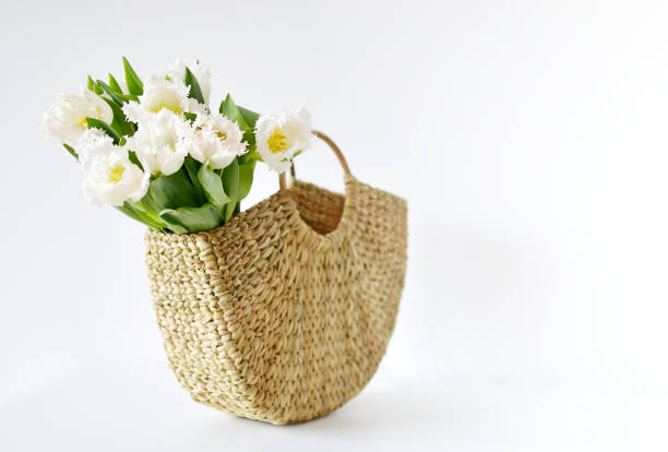 istock Wicker Handbag with Flowers Tulips 1136820756