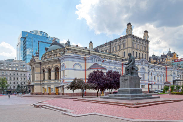 Kiev, Ukraine - July 06 2018: Monument to Mykola Lysenko\n(Ukrainian: Пам'ятник Миколі Лисенку) in front of the National Academic Theater of Opera and Ballet of Ukraine (Ukrainian: Національна опера України).