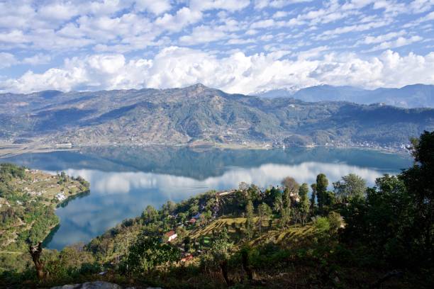 istock Blue sky, Couds, Mountains, Reflections, Fewa Lake, Pokhara, Nepal 1136824275