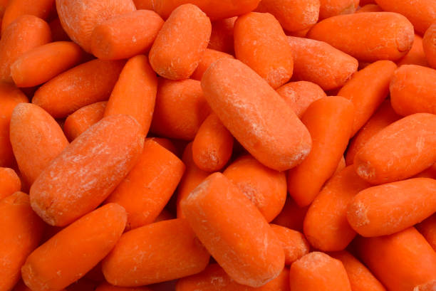 istock Little fresh carrots as a background. Snack. 1136827541