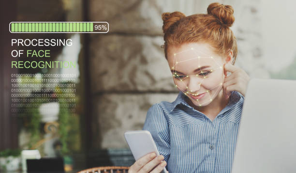 istock Woman using biometric facial verification on smartphone 1136827578
