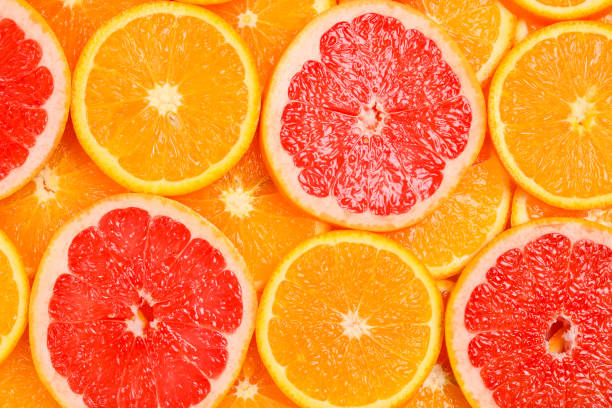 istock Slices of oranges and a grapefruits as a background. 1136827641