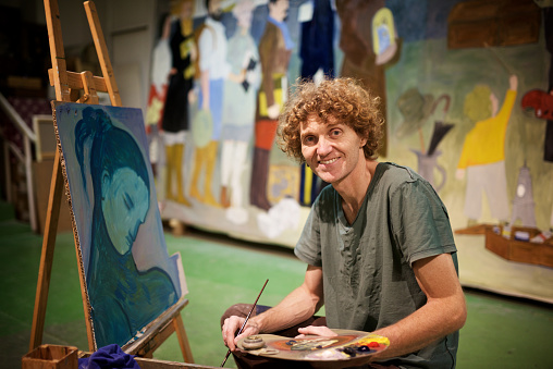 Painter working in his studio.