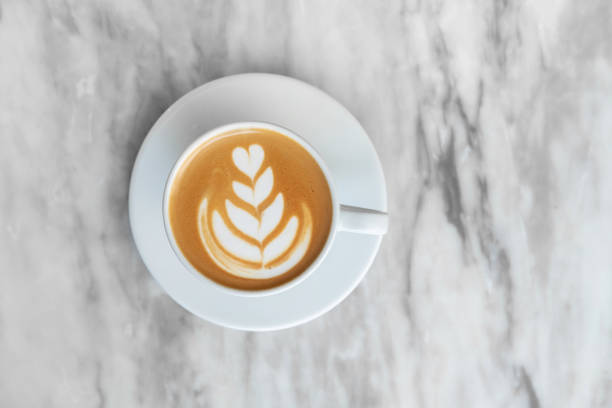 istock white cup of cappuccino on a marble background 1136829082