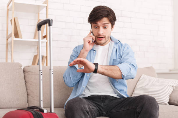 istock Angry tourist calling phone, late for the flight 1136835135